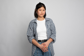 Asian woman wearing checkered shirt and t-shirt mockup