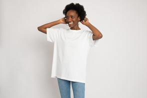 Smiling black woman with earrings in t-shirt mockup