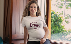 Pregnant woman sitting in window t-shirt mockup