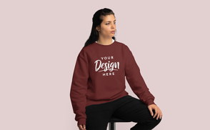 Brunette girl sitting in sweatshirt mockup
