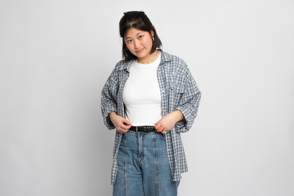 Asian female wearing checkered shirt and t-shirt mockup