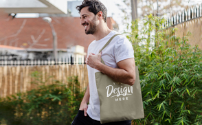 Male model outside tote bag mockup