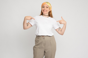 Hispanic girl with bandana pointing her t-shirt mockup