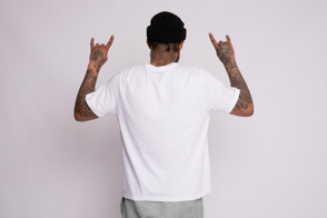 Young black man from behind in a t-shirt mockup