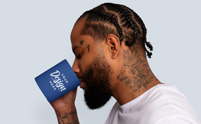 Tattooed man drinking from mug mockup | Start Editing Online