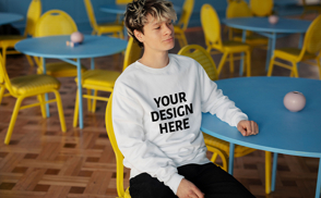 Man sitting in chair sweatshirt mockup