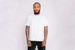 Black man with tattoos in a t-shirt mockup