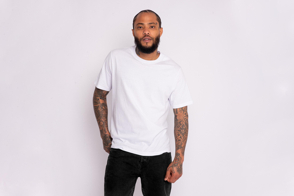 Tattooed black man posing in a t-shirt mockup