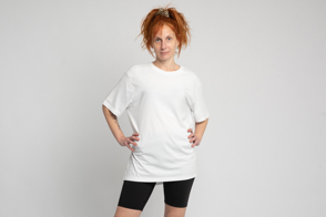 Redhead adult woman in black shorts and t-shirt mockup