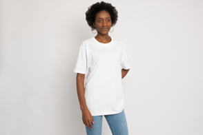 Black woman with large earrings in t-shirt mockup