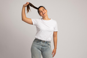 Hispanic woman with a ponytail in t-shirt mockup