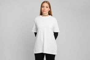 Blonde girl in black clothes with hands back and t-shirt mockup