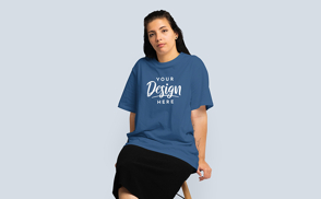 Brunette sitting oversized t-shirt mockup | Start Editing Online