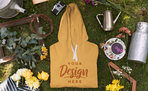 Hoodie over grass with picnic elements mockup