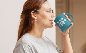 Model holding mug mockup