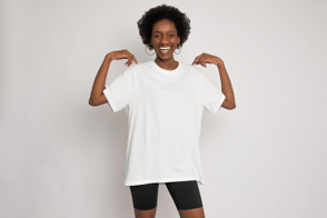 Smiling black woman in black shorts and t-shirt mockup