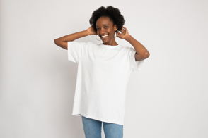 Smiling black girl with earrings in t-shirt mockup