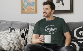 Model sitting with mug t-shirt mockup
