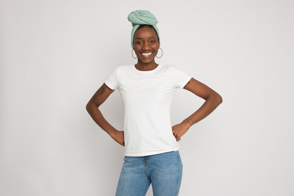 Black woman doing a strong pose in t-shirt mockup