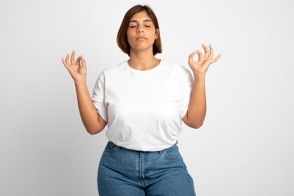 Plus size woman doing mudras in t-shirt mockup