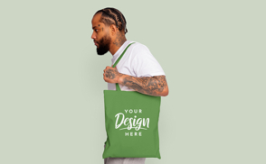 Young tattooed man tote bag mockup | Start Editing Online