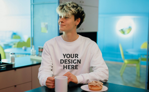 Man with mug and donut sweatshirt mockup