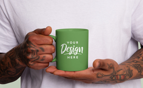 Tattooed man holding mug mockup | Edit Online & Download
