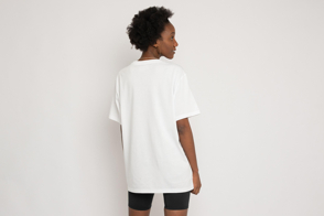 Black woman backwards wearing shorts and t-shirt mockup