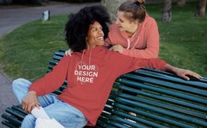 Man sitting on park bench hoodie mockup