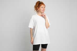 Redhead woman with thoughtful expression in t-shirt mockup
