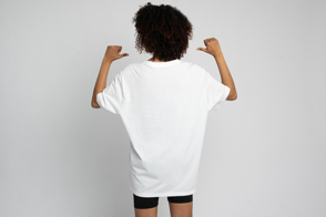 Black girl with afro in shorts and t-shirt mockup