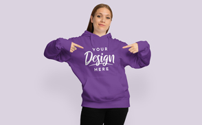 Cool girl pointing at her hoodie | Start Editing Online