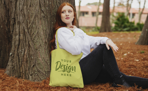 Woman in park tote bag mockup