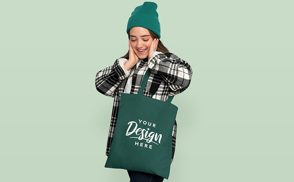 Teen girl with hat and tote bag mockup