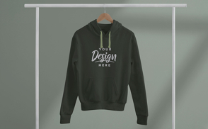 Hoodie hanging from clothes hanger mockup