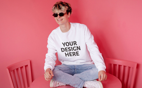 Man on table with sunglasses sweatshirt mockup