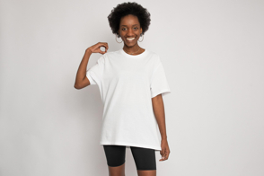 Black female with earrings smiling in t-shirt mockup