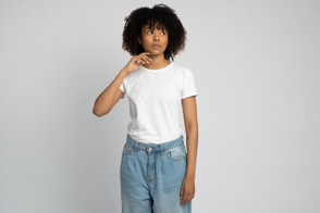 Black female with thoughtful expression in t-shirt mockup