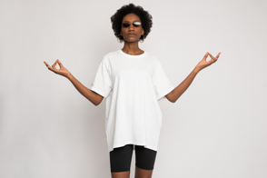 Black woman with zen gesture, sunglasses and t-shirt mockup