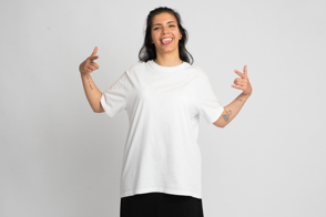 Latin american woman doing funny gestures in t-shirt mockup