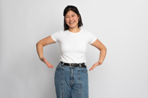 Smiling asian girl in jeans and t-shirt mockup