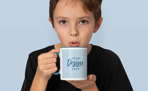 Little boy with coffee mug mockup
