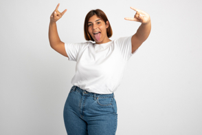 Plus size woman doing rocker gestures in t-shirt mockup