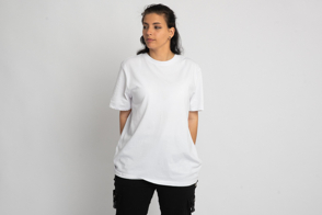 Latin american girl with hands behind back in t-shirt mockup