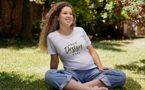 Pregnant woman sitting in grass t-shirt mockup