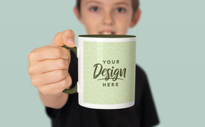 Child holding ceramic mug mockup