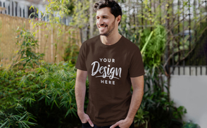 Smiling male model outside t-shirt mockup