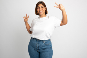 Plus size woman doing the V sign in t-shirt mockup