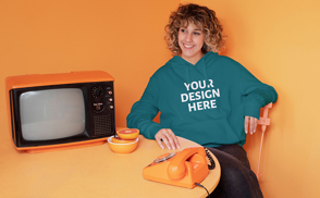 Woman with television and telephone hoodie mockup