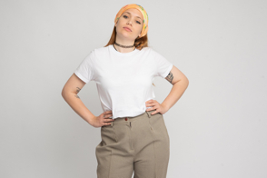 Hispanic girl with hands on the waist in t-shirt mockup